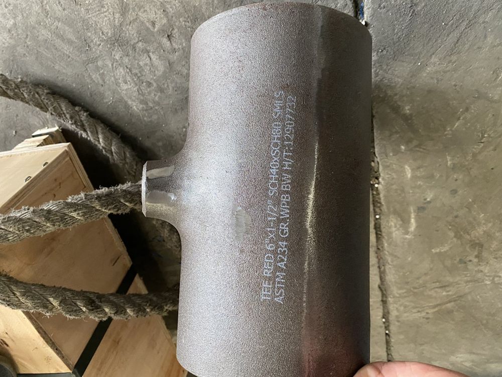 Marking on a reducing tee: size, schedule, ASTM A234 WPB and heat number